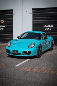 Porsche Cayman S Miami Blue vinyl wrap