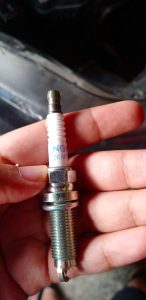 To address a fouled spark plug, an effective approach involves cleaning or eliminating black smoke and white residue that may have accumulated on the spark plugs.